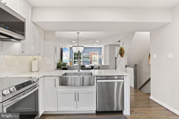 Chandelier, Dining room, Interior, Kitchen, Recessed Lighting, Stainless Steel Appliances, Wood Texture Flooring