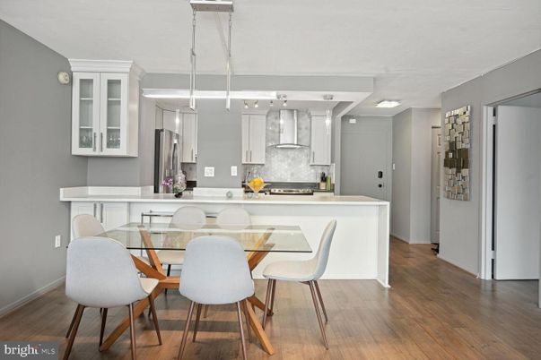 Dining room, Interior, Kitchen, Pendant Lights, Stainless Steel Appliances, Wood Texture Flooring