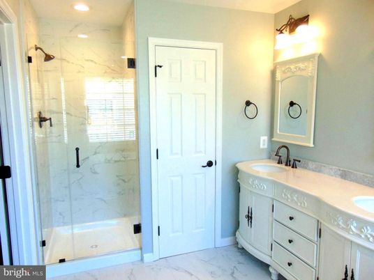 Bathroom, Dual Sink Vanities, Glass Shower, Interior, Marble, Marble Walls, Recessed Lighting