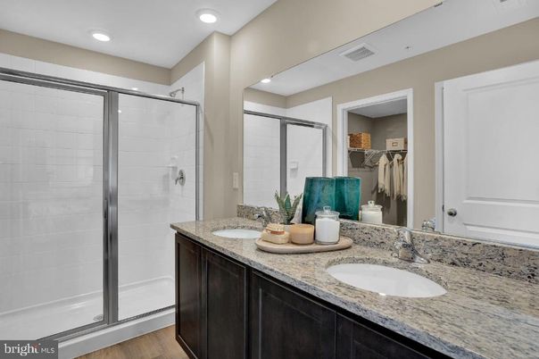 Bathroom, Dual Sink Vanities, Glass Shower, Interior, Recessed Lighting, Wood Texture Flooring