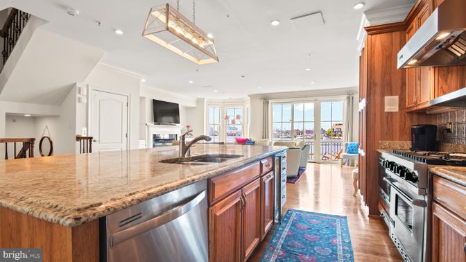 Fireplace, Interior, Kitchen, Living room, Pendant Lights, Recessed Lighting, Stainless Steel Appliances, Wood Texture Flooring
