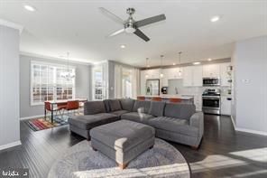 Chandelier, Dining room, Interior, Kitchen, Living room, Pendant Lights, Recessed Lighting, Stainless Steel Appliances, Wood Texture Flooring
