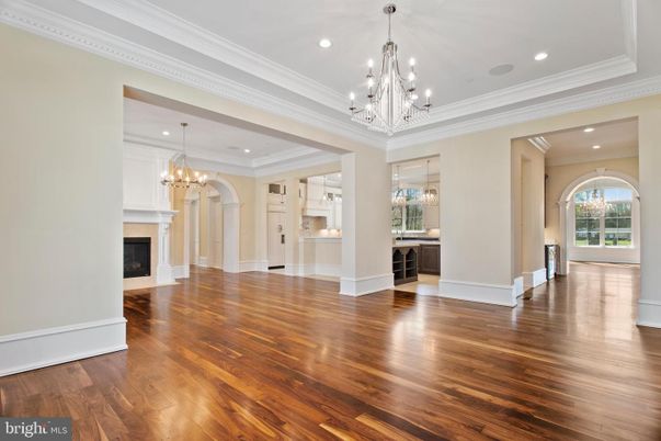 Chandelier, Empty room, Fireplace, Interior, Recessed Lighting, Wood Texture Flooring