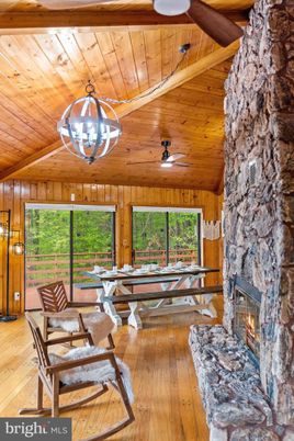 Chandelier, Dining room, Fireplace, Interior, Stone Walls, Wooden Beams, Wooden Ceilings, Wood Texture Flooring, Wooden Walls