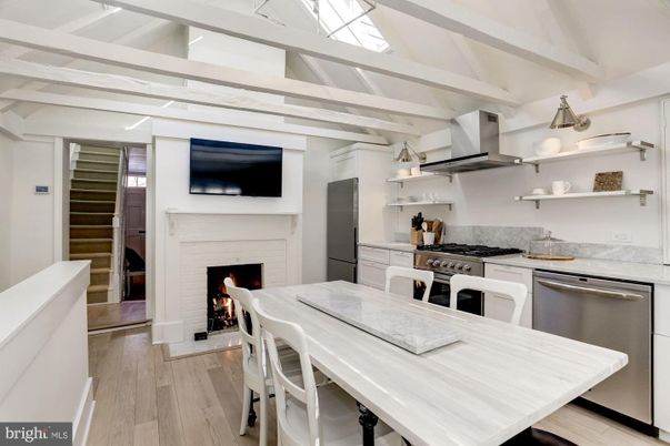Dining room, Fireplace, Interior, Kitchen, Stainless Steel Appliances, Wood Texture Flooring
