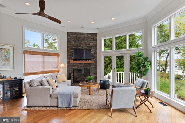 Fireplace, Interior, Living room, Recessed Lighting, Stone Walls, Sun Room, Wood Texture Flooring