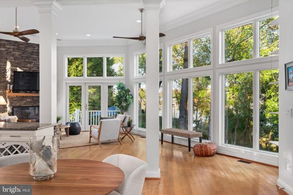Fireplace, Interior, Recessed Lighting, Stone Walls, Sun Room, Wood Texture Flooring