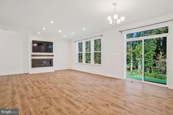 Chandelier, Empty room, Fireplace, Interior, Recessed Lighting, Wood Texture Flooring