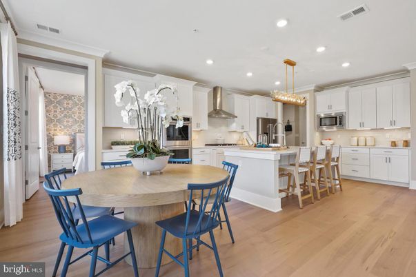 Chandelier, Dining room, Interior, Kitchen, Pendant Lights, Recessed Lighting, Stainless Steel Appliances, Wood Texture Flooring