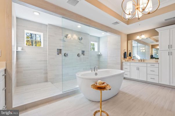 Bathroom, Chandelier, Dual Sink Vanities, Free Standing Baths, Glass Shower, Interior, Recessed Lighting, Wood Texture Flooring
