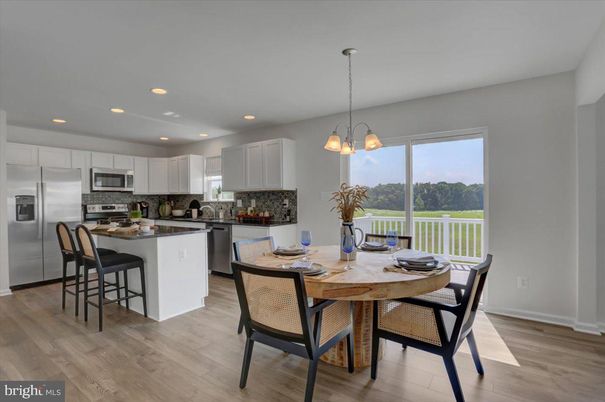 Dining room, Interior, Kitchen, Pendant Lights, Recessed Lighting, Stainless Steel Appliances, Wood Texture Flooring