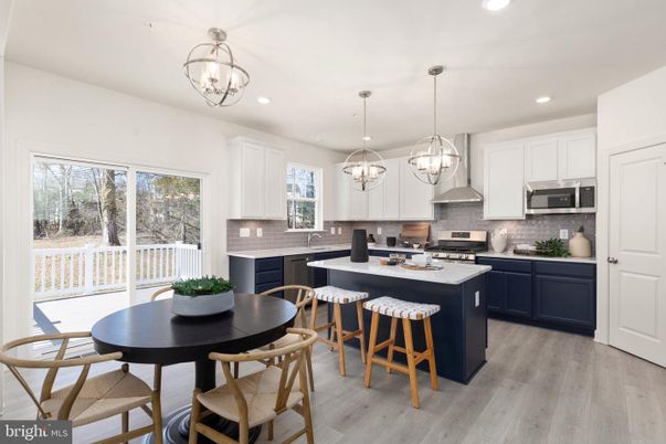 Chandelier, Dining room, Interior, Kitchen, Pendant Lights, Recessed Lighting, Stainless Steel Appliances, Wood Texture Flooring