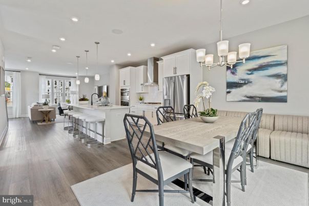 Chandelier, Dining room, Interior, Kitchen, Living room, Pendant Lights, Recessed Lighting, Stainless Steel Appliances, Wood Texture Flooring