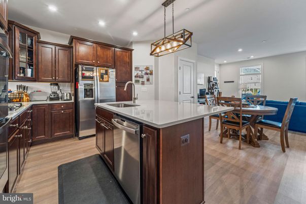 Dining room, Interior, Kitchen, Pendant Lights, Recessed Lighting, Stainless Steel Appliances, Wood Texture Flooring