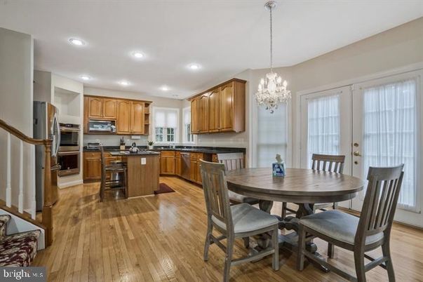 Chandelier, Dining room, Interior, Kitchen, Recessed Lighting, Stainless Steel Appliances, Wood Texture Flooring
