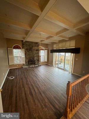 Empty room, Fireplace, Interior, Pendant Lights, Stone Walls, Wood Texture Flooring