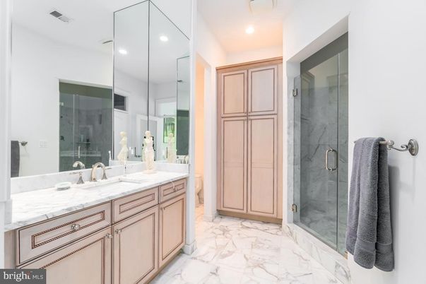 Bathroom, Dual Sink Vanities, Glass Shower, Interior, Marble, Marble Walls, Recessed Lighting