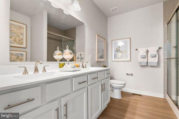 Bathroom, Dual Sink Vanities, Glass Shower, Interior, Wood Texture Flooring
