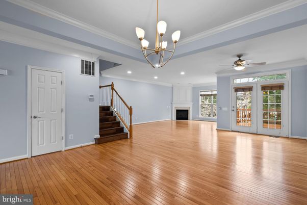 Chandelier, Empty room, Fireplace, Interior, Pendant Lights, Recessed Lighting, Wood Texture Flooring