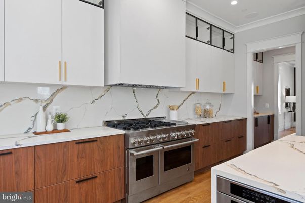 Interior, Kitchen, Marble Walls, Recessed Lighting, Stainless Steel Appliances, Wood Texture Flooring