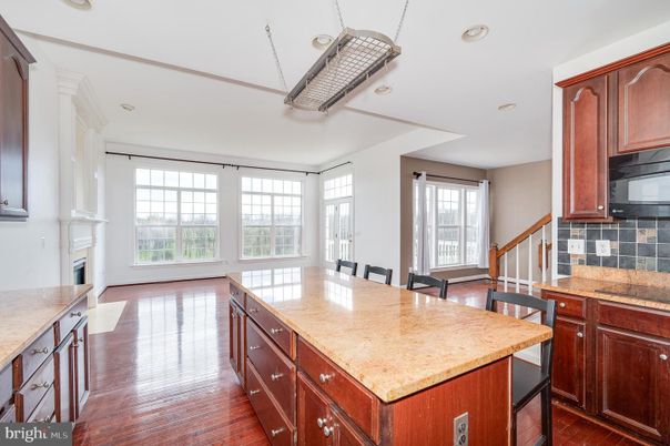 Dining room, Fireplace, Interior, Kitchen, Recessed Lighting, Wood Texture Flooring