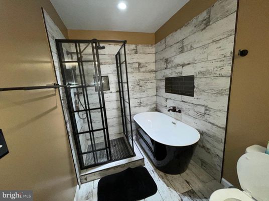 Bathroom, Free Standing Baths, Glass Shower, Interior, Recessed Lighting, Wood Texture Flooring