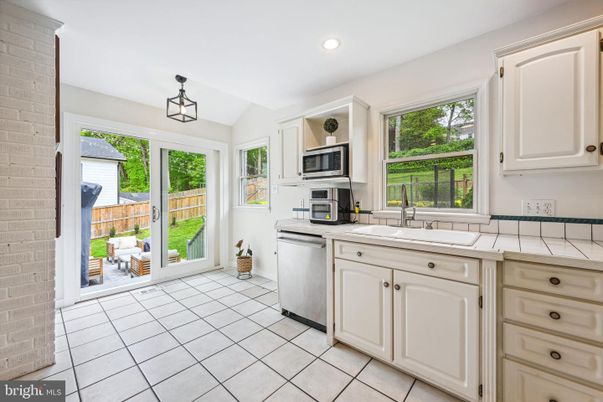 Interior, Kitchen, Pendant Lights, Recessed Lighting, Stainless Steel Appliances, Stone Walls, Tile Countertops