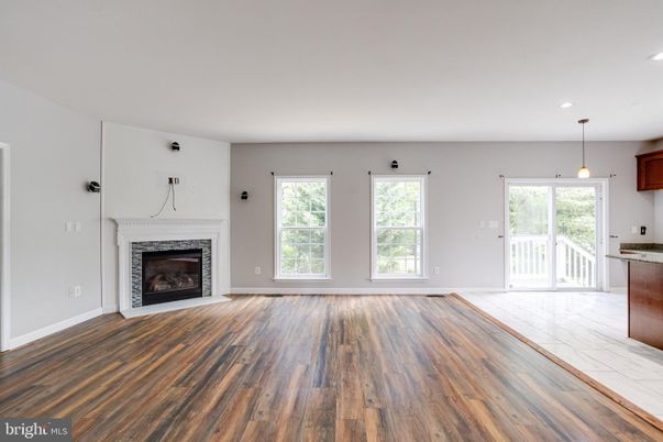 Empty room, Fireplace, Interior, Pendant Lights, Recessed Lighting, Wood Texture Flooring
