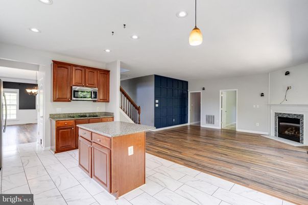 Fireplace, Interior, Kitchen, Marble, Pendant Lights, Recessed Lighting, Wood Texture Flooring