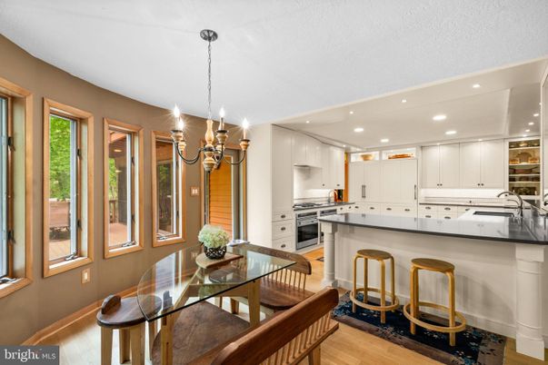 Chandelier, Dining room, Interior, Kitchen, Recessed Lighting, Stainless Steel Appliances, Wood Texture Flooring