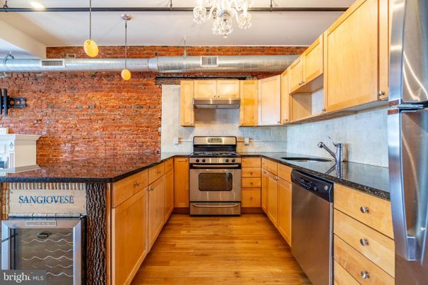 Interior, Kitchen, Pendant Lights, Stainless Steel Appliances, Stone Walls, Wood Texture Flooring