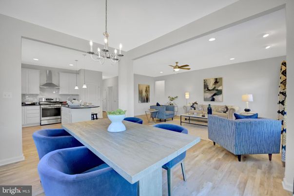 Chandelier, Dining room, Interior, Kitchen, Living room, Pendant Lights, Recessed Lighting, Stainless Steel Appliances, Wood Texture Flooring