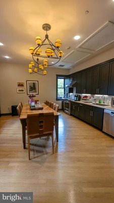 Chandelier, Dining room, Interior, Kitchen, Pendant Lights, Recessed Lighting, Stainless Steel Appliances, Wood Texture Flooring