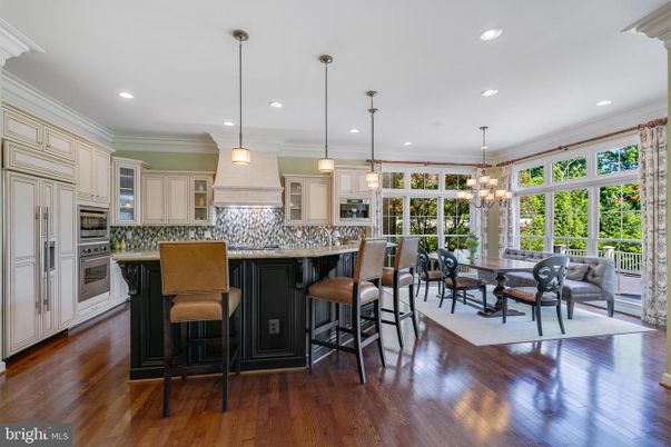 Chandelier, Dining room, Interior, Kitchen, Pendant Lights, Recessed Lighting, Stainless Steel Appliances, Wood Texture Flooring