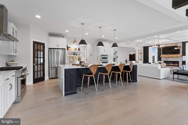 Fireplace, Interior, Kitchen, Living room, Pendant Lights, Recessed Lighting, Stainless Steel Appliances, Wood Texture Flooring
