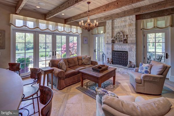 Chandelier, Fireplace, Interior, Living room, Recessed Lighting, Stone Walls, Wooden Beams, Wooden Ceilings