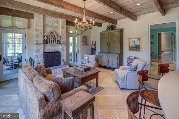 Chandelier, Fireplace, Interior, Living room, Recessed Lighting, Stone Walls, Wooden Beams, Wooden Ceilings