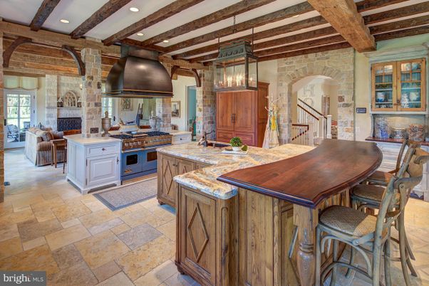 Dining room, Fireplace, Interior, Kitchen, Living room, Pendant Lights, Recessed Lighting, Stainless Steel Appliances, Stone Walls, Wooden Beams