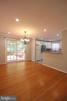 Chandelier, Empty room, Interior, Kitchen, Recessed Lighting, Stainless Steel Appliances, Wood Texture Flooring