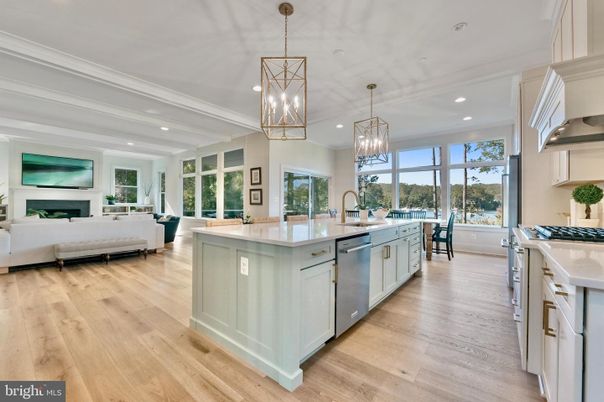 Chandelier, Dining room, Fireplace, Interior, Kitchen, Living room, Pendant Lights, Recessed Lighting, Stainless Steel Appliances, Wood Texture Flooring