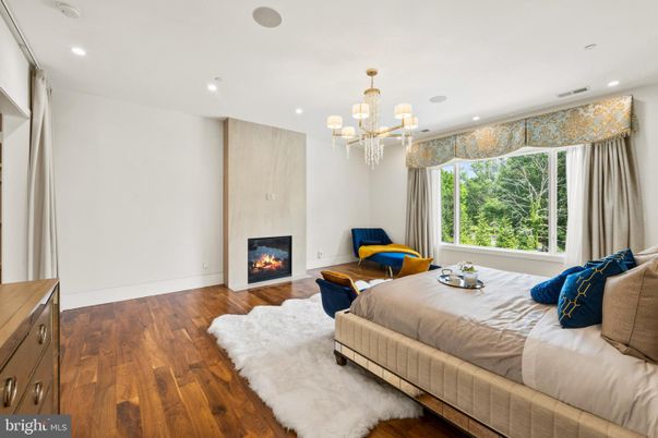 Bedroom, Chandelier, Fireplace, Interior, Recessed Lighting, Wood Texture Flooring