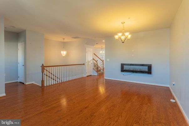 Chandelier, Empty room, Fireplace, Interior, Pendant Lights, Wood Texture Flooring
