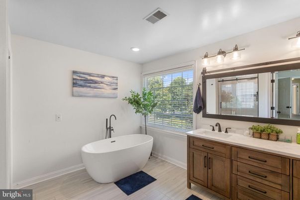 Bathroom, Dual Sink Vanities, Free Standing Baths, Interior, Recessed Lighting, Wood Texture Flooring