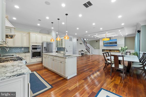 Dining room, Interior, Kitchen, Pendant Lights, Recessed Lighting, Stainless Steel Appliances, Wood Texture Flooring