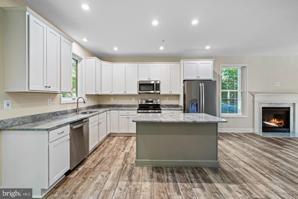 Fireplace, Interior, Kitchen, Recessed Lighting, Stainless Steel Appliances, Wood Texture Flooring