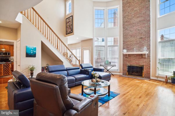 Fireplace, Interior, Kitchen, Living room, Recessed Lighting, Stone Walls, Wood Texture Flooring