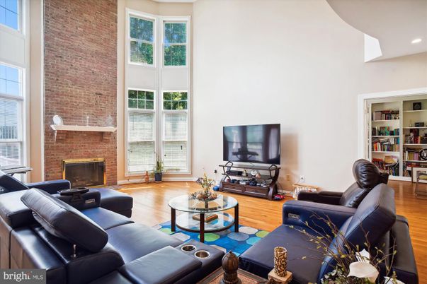 Fireplace, Interior, Living room, Recessed Lighting, Stone Walls, Wood Texture Flooring