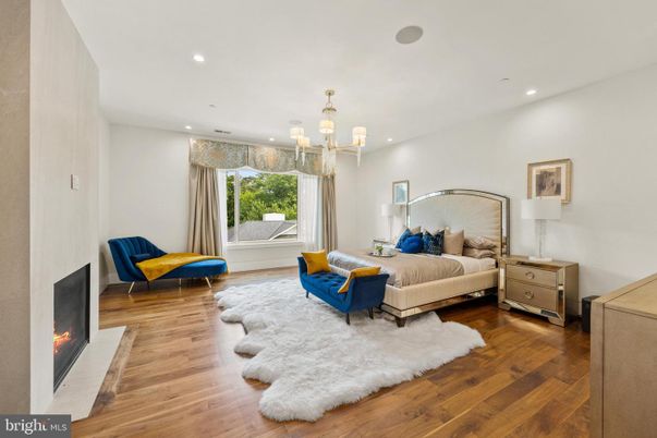 Bedroom, Chandelier, Fireplace, Interior, Recessed Lighting, Wood Texture Flooring