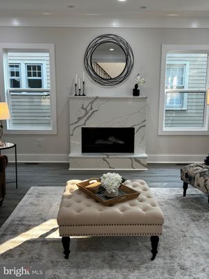 Fireplace, Interior, Marble Walls, Recessed Lighting, Wood Texture Flooring