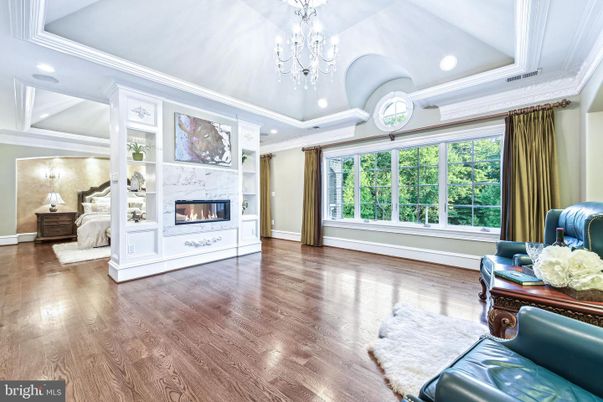 Bedroom, Chandelier, Fireplace, Interior, Recessed Lighting, Wood Texture Flooring